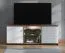 TV-Schrank / TV-Möbel mit zwei Türen Kanjiza 02, Farbe: Eiche Flagstaff / Weiß / Weiß Hochglanz, zwei Kabeldurchführungen, Maße: 59,5 x 157 x 40 cm, sechs Fächer
