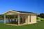 Ferienhaus F50 mit überdachter Terrasse | 9,61 m² | 70 mm Blockbohlen | Naturbelassen | inkl. Fußboden & Isolierverglasung