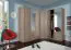 Kleiderschrank | 4 Drehtüren | 2 Schubladen | 7 Fächer | mit 2 Kleiderstangen | 200 cm breit | Farbe: Sonoma Eiche Abbildung